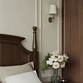 Cozy Bedroom Interior With Dark Wooden Headboard Wall Lamp And Flower Vase