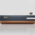 Modern Reception Desk With Dark Blue And Copper Finish White Ornaments And Pink Flowers