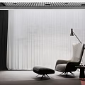 Modern Living Space Interior Design With Single Seater Sofa Ottoman Floor Lamp And Curtains