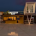 Modern Commercial Street Featuring Unique Architecture Coffee Shop Evening Lighting And Reflective Ground