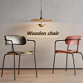 Wooden Dining Chairs With Silver And Red Seats And Black Metal Legs