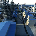 Large Scale Industrial Plant With Piping Systems Buildings Surrounding River And Roads