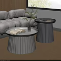 Modern Gray Sofa And Round Pleated Coffee Tables Set With Open Book And Green Plant