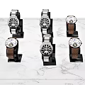 Elegant Mechanical Watches with Metal and Brown Leather Straps on Marble Tabletop