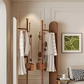 Elegant Modern Clothes Rack With White Clothes Brown Bags And Green Decorative Painting In Interior