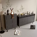 Gray Chest of Drawers with Green Plants Rabbit Figurine and Floor Lamp on Striped Rug