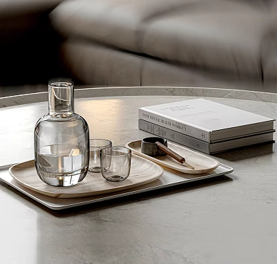 Modern Glass Cups On Tray With Books And Clear Bottle On Marble Tabletop 3d model
