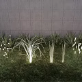Grass And Reed Shaped Outdoor Lights With White Light On Green Grass And Gray Wall