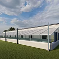 Modern Sports Fitness Facility With Glass Roof And Walls On Green Lawn Surrounding Trees