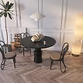 Modern Black Round Dining Table Set With Curved Chairs Green Plant And Floor Lamp