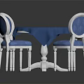 Round Blue Tabletop Dining Table Set with White Legs and Blue Cushioned Chairs