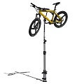 Yellow Mountain Bicycle Mounted On Repair Stand With Large Off Road Tires