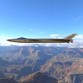 Gray Fighter Jet Flying Over Canyon With Mountainous Landscape And Trees