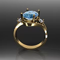 Elegant Gold Ring With Sparkling Blue Center Gemstone And Small Diamonds