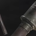 Ancient Weapon With Intricate Wooden Handle And Decorative Metal Accents