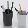 Black and white pencil holders with various colorful pens and pencils