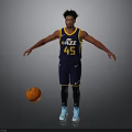 Man In Utah Jazz Number 45 Jersey Standing With Basketball On Gray Background