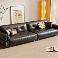 Black Leather Three-Seater Sofa with Brown and Yellow Cushions in Modern Interior