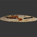 Intricate Ancient Circular Sculpture Carving with Geometric Patterns Eye Design and Pale Orange Speckled Openwork