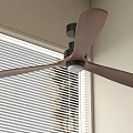 Modern Interior Ceiling Fan With Wooden Blades Near Window Blinds