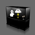 Black Glass Door Display Cabinet Featuring White Bust Statue Yellow Lamp And Small Vintage Telephone