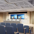 School Modern Auditorium With Blue Seats Large Screens And Ceiling Lights