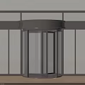 Modern Revolving Door with Glass Panels and Metal Frame in White Room
