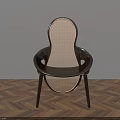 Modern Dining Chair With Woven Design And Dark Frame On Herringbone Wooden Floor