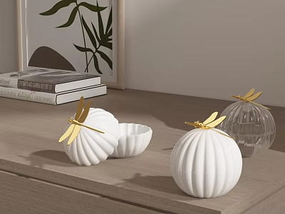 White Ceramic Vessels Spherical And Bowl Shaped With Gold Dragonfly Decorations On Wooden Tabletop 3d model