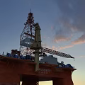Offshore Oil Drilling Platform Industrial Equipment with Drilling Tower and Crane under Sunset Sky