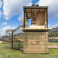 Modern Wooden Cabin with Large Glass Windows Surrounded by Trees Staircase to Terrace with Plants