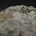 Rocky Mountainous Terrain With Debris Soil And Small Vegetation