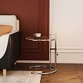 Modern Interior Side Table With Round Glass Top Metal Frame Beside Sofa On Wooden Floor