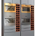 Modern Kitchen With Built In Ovens Wine Racks And Stainless Steel Cabinets