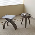 Two Wooden Stools With Curved Legs Round Top Featuring Books On Geometric Carpet