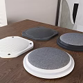 Modern Audio Speakers In White Black And Gray On Wooden Table With Mesh Design