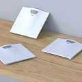 Three Modern White Digital Scales As Business Equipment On Wooden Table