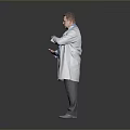 Male Doctor Wearing White Coat With Stethoscope Gesturing In Gray Background