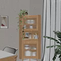 Wooden Sideboard Cabinet with Glass Doors Displaying Dishes Green Plant Framed Artwork and White Chair
