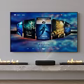 Smart TV Displaying Movie Posters With Soundbar On Flame Decorated TV Stand