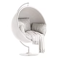 Round Golden Frame Hanging Chair With White Cushions And Gray Blanket