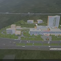 Aerial Planning of Urban Architectural Complex With Buildings Greenery Roads and Mountains