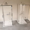 Two Modern Shower Sauna Units With Transparent Glass And Metal Frames