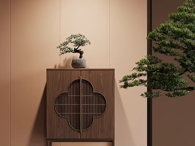 Wooden Decorative Cabinet with Quatrefoil Lattice Door Topped with Bonsai Tree Against Light Brown Wall 3d model