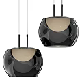 Two Modern Black Pendant Lights With Sleek Spherical Design And Beige Interior
