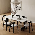 Modern Dining Table Set With White Oval Table Black Chairs White Cushions And Decorative Painting