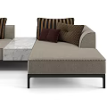 Beige Sectional Sofa With Brown Striped Pillows And Modern Metal Frame Design