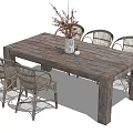 Rustic Wooden Dining Table Set with White Framed Wicker Chairs and Vase with Twigs