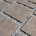 Modern Outdoor Ground Design With Gray Square Tiles And White Pebbles