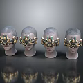 Four Human Head Models Wearing Gold And Green Mechanical Headgear On Reflective Surface
